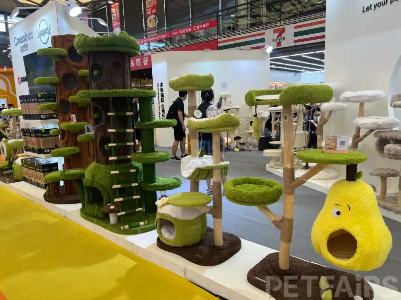A panoramic view of Petfair Asia 2025 at the Shanghai New International Expo Centre, featuring crowded exhibition halls, international pet brands, and professional visitors.