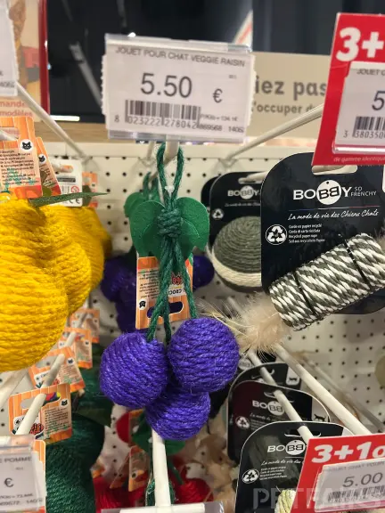 Interior view of Animalis pet store in France, showcasing neatly arranged pet food aisles, aquariums, and small animal enclosures — a modern retail space dedicated to pet care and professional service.