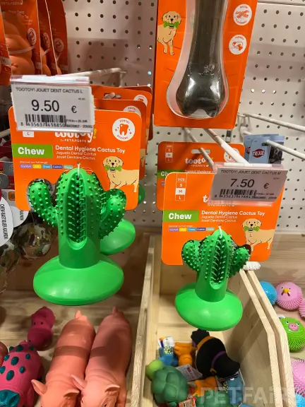Interior view of Animalis pet store in France, showcasing neatly arranged pet food aisles, aquariums, and small animal enclosures — a modern retail space dedicated to pet care and professional service.