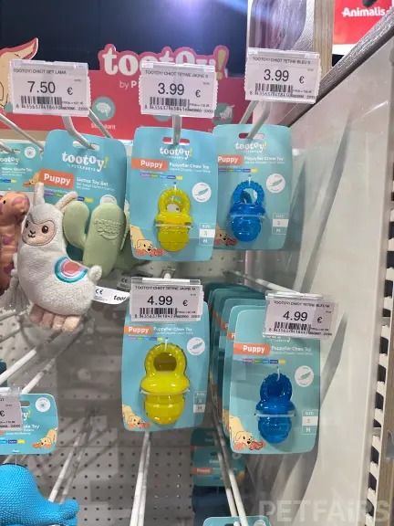 Interior view of Animalis pet store in France, showcasing neatly arranged pet food aisles, aquariums, and small animal enclosures — a modern retail space dedicated to pet care and professional service.