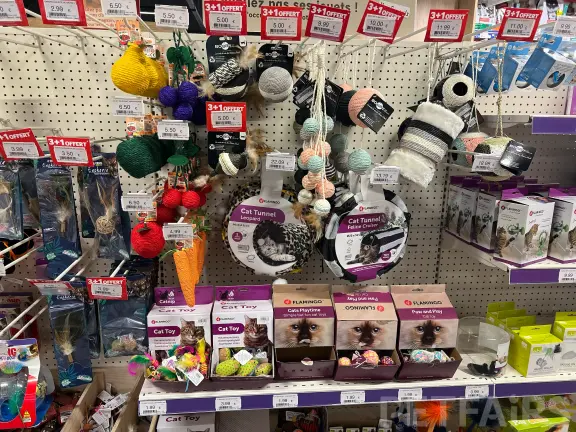 Interior view of Animalis pet store in France, showcasing neatly arranged pet food aisles, aquariums, and small animal enclosures — a modern retail space dedicated to pet care and professional service.