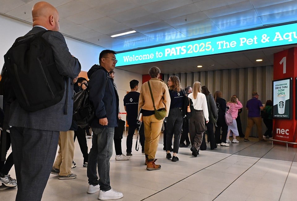 Visitors exploring the dedicated Aquatics Zone at PATS 2025, with tanks, water-gardening setups, reptile enclosures, and aquascaping demonstrations.