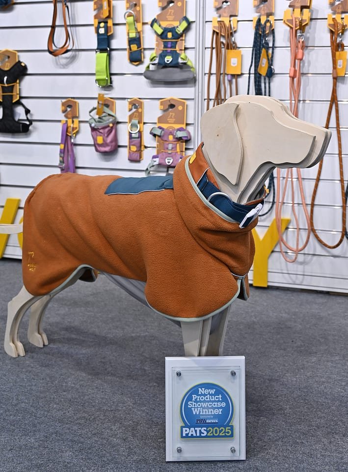 New Product Showcase at PATS 2025 featuring innovative pet toys, aquatics accessories, grooming tools, and eco-friendly pet care products displayed under bright exhibition lighting.