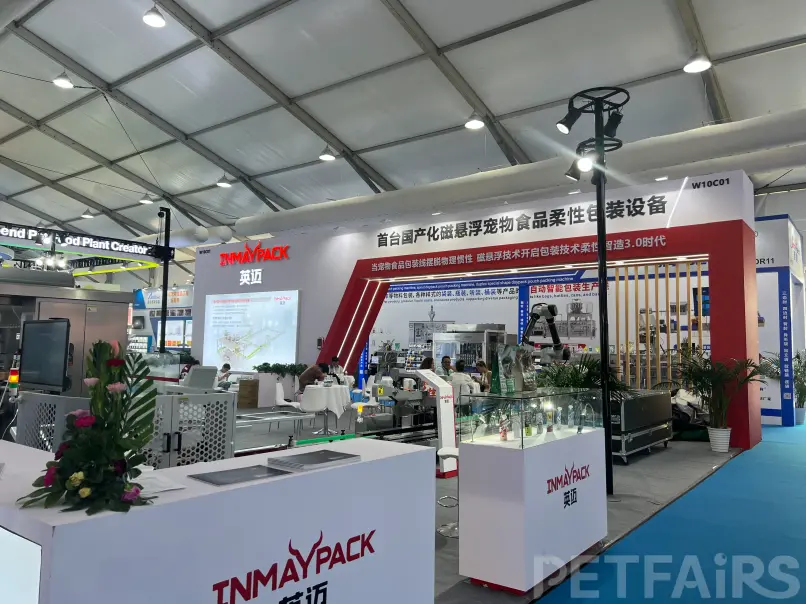 A panoramic view of Petfair Asia 2025 at the Shanghai New International Expo Centre, featuring crowded exhibition halls, international pet brands, and professional visitors.