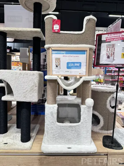 Interior view of Animalis pet store in France, showcasing neatly arranged pet food aisles, aquariums, and small animal enclosures — a modern retail space dedicated to pet care and professional service.