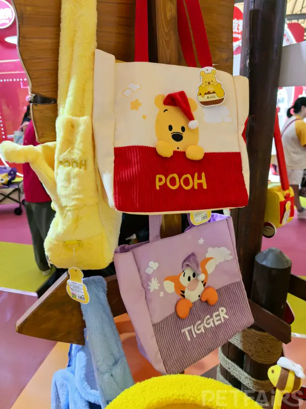 A panoramic view of Petfair Asia 2025 at the Shanghai New International Expo Centre, featuring crowded exhibition halls, international pet brands, and professional visitors.