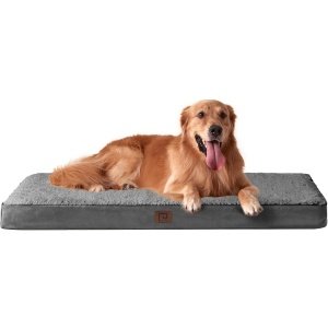 EHEYCIGA fluffy calming dog bed in round donut shape, ultra-soft faux fur surface for anxiety relief and cozy sleep.